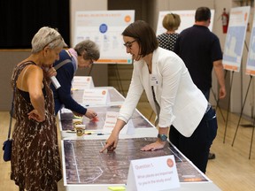 Edmontonians discuss the design and alignment of the future Central/East LRT line during an open house at the Bonnie Doon Community Hall in July 2017.