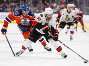 Edmonton's Patrick Maroon (19) chases Ottawa's Tom Pyatt (10) during the second period of a NHL game between the Edmonton Oilers and the Ottawa Senators at Rogers Place in Edmonton, Alberta on Sunday, October 30, 2016.