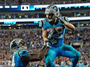 Carolina Panthers' Christian McCaffrey celebrates his touchdown catch against the Philadelphia Eagles with Ed Dickson during an NFL game in Charlotte on Oct. 12, 2017. (AP Photo/Mike McCarn)