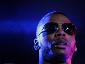 In this April 18, 2015 file photo, rapper Nelly preforms on stage during a Corner Block Party concert at Auburn University in Auburn, Ala. (AP Photo/Brynn Anderson, File)