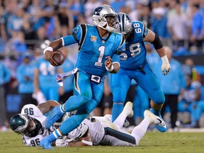 Cam Newton #1 of the Carolina Panthers scrambles away from Derek Barnett #96 of the Philadelphia Eagles during their game at Bank of America Stadium on October 12, 2017 in Charlotte, North Carolina. (Photo by Grant Halverson/Getty Images)