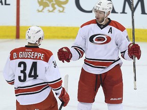 Carolina Hurricanes centre Jordan Staal (right) celebrates his first-period goal against the Winnipeg Jets with forward Phillip Di Giuseppe in Winnipeg on Fri., Feb. 5, 2016. Kevin King/Winnipeg Sun/Postmedia Network