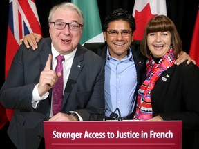 Attorney General Yasir Naqvi (centre) joined Marie-France Lalonde, Minister Responsible for Francophone Affairs, and François Boileau, French Language Services Commissioner, to announce new steps the province is taking to improve stronger access to justice in the French language Wednesday (October 11, 2017) at Ottawa City Hall. (Julie Oliver/Postmedia)