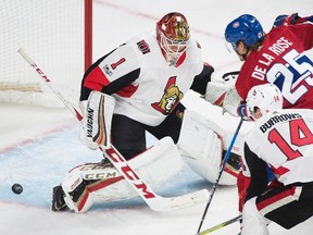 Montreal Canadiens' Jacob De La Rose scores against Ottawa Senators goaltender Mike Condon as Senators' Alexandre Burrows defends during third period NHL pre-season hockey action in Montreal, Saturday, September 30, 2017. (THE CANADIAN PRESS/Graham Hughes)