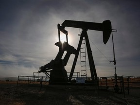 A pumpjack works at a well head on an oil and gas installation near Cremona, Alta., Saturday, Oct. 29, 2016. Oil and gas companies in Alberta are accelerating voluntary reclamation of old well sites and pipelines.THE CANADIAN PRESS/Jeff McIntosh