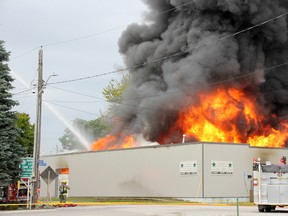 Crews are shown fighting a fire on Thames Street in Chatham on Saturday afternoon. (Trevor Terfloth/The Daily News)