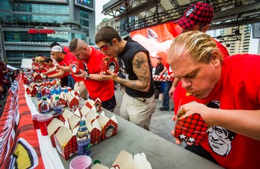 John Jugovic (right) at the 8th Annual Smoke�s Poutinerie World Poutine Eating Championship held at Yonge-Dundas Square in downtown Toronto, Ont.  on Saturday October 14, 2017. Ernest Doroszuk/Toronto Sun/Postmedia Network