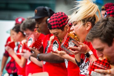 Miki Sudo at the 8th Annual Smoke�s Poutinerie World Poutine Eating Championship held at Yonge-Dundas Square in downtown Toronto, Ont.  on Saturday October 14, 2017. Ernest Doroszuk/Toronto Sun/Postmedia Network