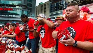 Jim Reeves (right) at the 8th Annual Smoke�s Poutinerie World Poutine Eating Championship held at Yonge-Dundas Square in downtown Toronto, Ont.  on Saturday October 14, 2017. Ernest Doroszuk/Toronto Sun/Postmedia Network