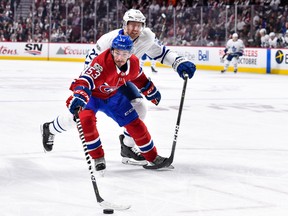 Maple Leafs centre Eric Fehr stays close to the Canadiens’ Victor Mete in Montreal on Saturday night. Fehr and Dominic Moore (inset) have been sharing fourth-line centre duties. (Getty Images)