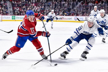 MONTREAL, QC - OCTOBER 14:  Jake Gardiner #51 of the Toronto Maple Leafs tries to block a shot by Brendan Gallagher #11 of the Montreal Canadiens during the NHL game at the Bell Centre on October 14, 2017 in Montreal, Quebec, Canada.  (Photo by Minas Panagiotakis/Getty Images)