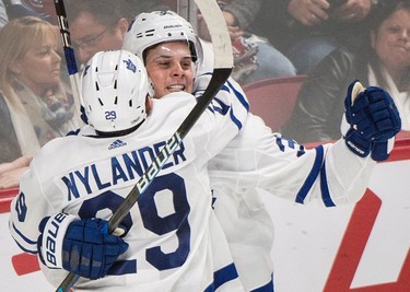 Toronto Maple Leafs' Auston Matthews (34) celebrates with teammate William Nylander after scoring during overtime NHL hockey action against the Montreal Canadiens, in Montreal, Saturday, October 14, 2017. THE CANADIAN PRESS/Graham Hughes