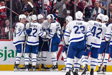 MONTREAL, QC - OCTOBER 14:  Auston Matthews #34 of the Toronto Maple Leafs celebrates his overtime goal with teammates against the Montreal Canadiens during the NHL game at the Bell Centre on October 14, 2017 in Montreal, Quebec, Canada.  The Toronto Maple Leafs defeated the Montreal Canadiens 4-3 in overtime.  (Photo by Minas Panagiotakis/Getty Images)