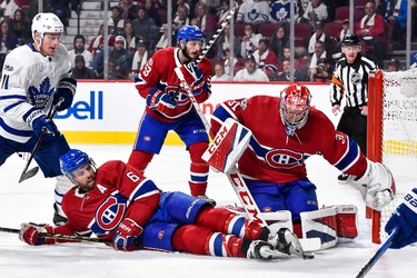 MONTREAL, QC - OCTOBER 14:  Shea Weber #6 of the Montreal Canadiens falls as he tries to defend the puck near goaltender Carey Price #31 against the Toronto Maple Leafs during the NHL game at the Bell Centre on October 14, 2017 in Montreal, Quebec, Canada.  The Toronto Maple Leafs defeated the Montreal Canadiens 4-3 in overtime.  (Photo by Minas Panagiotakis/Getty Images)