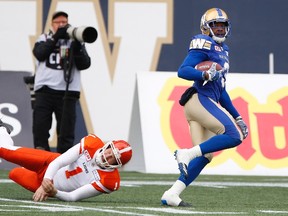 B.C. Lions kicker Ty Long (1) can't stop Winnipeg Blue Bombers defensive back Kevin Fogg (3) as he returns his kick for the touchdown during the first half of CFL action in Winnipeg on Saturday, October 14, 2017. THE CANADIAN PRESS/John Woods