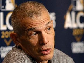 New York Yankees manager Joe Girardi reacts as he answers reporters' questions during a press conference before an American League Championship Series baseball workout day in New York, Sunday, Oct. 15, 2017.  (AP Photo/Kathy Willens)
