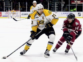 Sarnia Sting captain Jordan Kyrou (25) tries to skate past Guelph Storm's Cedric Ralph (14) in the second period at Progressive Auto Sales Arena in Sarnia, Ont., on Saturday, Oct. 14, 2017. (Mark Malone, Postmedia Network file photo)
