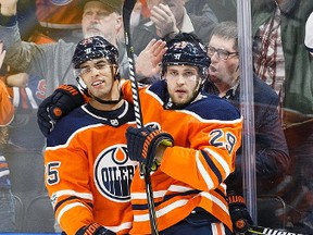 Darnell Nurse #25 and Leon Draisaitl #29 of the Edmonton Oilers celebrate Draisaitl's goal against the Winnipeg Jets at Rogers Place on October 9, 2017 in Edmonton, Canada.