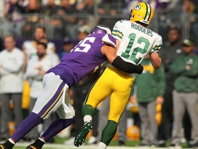 Anthony Barr of the Minnesota Vikings hits  Green Bay Packers quarterback Aaron Rodgers during the first quarter of the game on Oct. 15, 2017 at US Bank Stadium in Minneapolis, Minn. (Adam Bettcher/Getty Images)