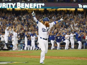 Justin Turner of the Los Angeles Dodgers celebrates after hitting the winning home run in the bottom of the ninth inning making the score 4-1 during Game 2 of the National League Championship Series against the Chicago Cubs at Dodger Stadium on Oct. 15, 2017 in Los Angeles. (Ezra Shaw/Getty Images)