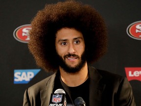 This Dec. 24, 2016 photo shows San Francisco 49ers quarterback Colin Kaepernick talking during a news conference after an NFL football game against the Los Angeles Rams.  (AP Photo/Rick Scuteri)