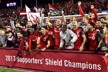 The Toronto FC celebrate with the Supporters' Shield following their win over the Montreal Impact in MLS soccer action in Toronto on Sunday, October 15, 2017. THE CANADIAN PRESS/Frank Gunn ORG XMIT: FNG508