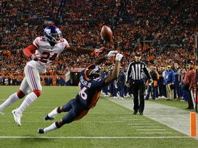 Denver Broncos wide receiver Bennie Fowler, right, can't make the end zone catch as New York Giants cornerback Eli Apple (24) defends during the first half of an NFL football game Sunday, Oct. 15, 2017, in Denver. (AP Photo/Jack Dempsey)
