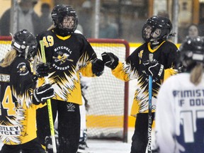 Sisters Joy (left) and Maya Belfour (10) celebrate Emma Lincoln’s goal as the Mitchell U14 ringette team defeated St. Marys 11-3 last Saturday, Oct. 14. ANDY BADER/MITCHELL ADVOCATE