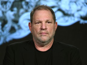 In this Jan. 6, 2016, file photo, producer Harvey Weinstein participates in a panel at the A&E 2016 Winter TCA in Pasadena, Calif. The Weinstein Co., mired in a sex scandal, may be putting itself up for sale. The company said Monday, Oct. 16, 2017, that it is getting an immediate cash infusion from Colony Capital and is in negotiations for the potential sale of all or a significant portion of the movie studio responsible for films like "Shakespeare in Love," and "Gangs of New York." (Photo by Richard Shotwell/Invision/AP, File)