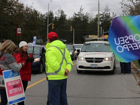 BRUCE BELL/THE INTELLIGENCER
Striking Loyalist College faculty members stop vehicles entering the campus on Monday morning to share information. More than 12,000 college teachers across the province walked of the job after talks with the College Employer Council broke down.