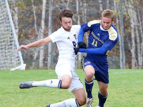 Jack Wadden of the University of Toronto Varsity Blues battles for the ball with Liam Izzard of the Laurentian Voyageurs during OUA men's soccer action in Sudbury, Ont. on Sunday October 15, 2017. Gino Donato/Sudbury Star/Postmedia Network