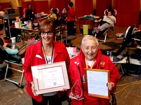 Cathy Schmidt (left) volunteer co-ordinator with Canadian Blood Services, presented Leona Bishop with three honours recognizing her 23 years as a dedicated volunteer with the blood collection agency on her last day as a volunteer at the blood donor clinic in Chatham.