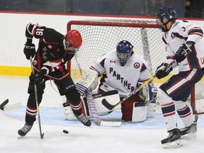 Pete Fisher/Postmedia Network
Justin Arnold of the Picton Pirates (16) tries to get a shot away on Port Hope Panthers goaltender Colin Husovic during Provincial Junior Hockey League action at the Jack Burgers Sports Complex on Saturday in Port Hope. Picton won the game, 5-2.