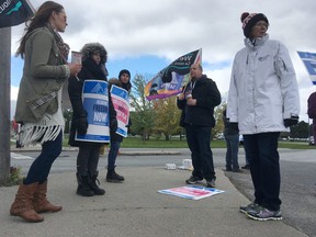 Striking St. Lawrence College faculty picket in front the college Monday morning in Kingston, Ont. on Monday, Oct. 16, 2017. 
Elliot Ferguson/The Whig-Standard/Postmedia Network