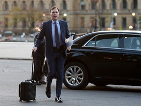 Finance Minister Bill Morneau arrives to work on Parliament Hill, in Ottawa on Monday, Oct. 16, 2017. (Sean Kilpatrick/The Canadian Press)