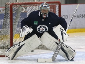 Steve Mason stares down a shooter during Winnipeg Jets practice at MTS Iceplex in Winnipeg on Mon., Oct. 16, 2017. Kevin King/Winnipeg Sun/Postmedia Network