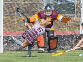 Regiopolis-Notre Dame Panthers goalkeeper Brianna Goslin makes a pad save on a point-blank shot from Jenna Churchill-Anderson of the Frontenac Falcons in the first half of their Kingston Area Secondary Schools Athletic Association field hockey game on Sept. 26 at CaraCo Home Field. The teams tied, 1-1. The Falcons finished their regular schedule with a 4-1-3 record and the Panthers ended up 4-2-2. They head into the final day of league competition in third and fourth place, respectively, but could each fall a spot if the Sydenham Golden Eagles (4-2-0) are successful in their final two games Tuesday. (Tim Gordanier/The Whig-Standard)