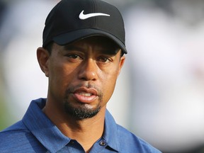 In this Feb. 2, 2017, file photo, Tiger Woods reacts on the 10th hole during the first round of the Dubai Desert Classic golf tournament in Dubai, United Arab Emirates. (AP Photo/Kamran Jebreili, File)