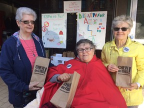 United Church Women members marked International Day for the Eradication of Poverty by handing out Chew on This! lunch bags in downtown Woodstock. From left Darlene Nicholls, Judy Crane and Carrol Morrisson. (HEATHER RIVERS, Sentinel-Review)