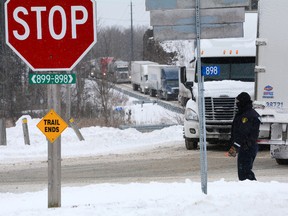 Traffic backs up at the intersection of County Roads 2 and 3 as as result of a massive Highway 401 collision in this March 15, 2017 file photo. (FILE PHOTO)