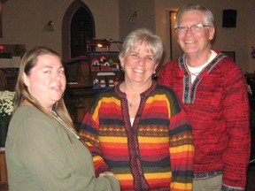 Mary Simmons, president of Maitland Presbyterial is seen welcoming Deb and Bob Loree of Listowel to the Fall Rally.