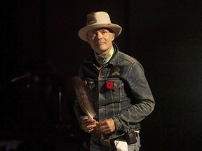 Chris Young/CANADIAN PRESS file photo 
Gord Downie steps on to the stage in Toronto, on Friday October 21, 2016. Downie, the poetic lead singer of the Tragically Hip whose determined fight with brain cancer inspired a nation, has died. He was 53.