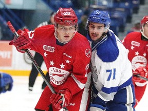 Barrett Hayton of the Sault Ste. Marie Greyhounds battles for position with David Levin of the Sudbury Wolves during OHL action from the Sudbury Community Arena in Sudbury, Ont. on Wednesday October 18, 2017. Gino Donato/Sudbury Star/Postmedia Network