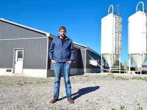 Jonathan Giret stands in front of his West Elgin barn, purchased in 2015. The ambitious Springfield native is trying to succeed in an industry largely abandoned by young people, leaning into agriculture — and succeeding. (Louis Pin/Times-Journal)