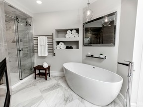A clean, timeless bathroom design by William Standen Co featuring a free-standing tub and low threshold walk in shower. (Handout/Postmedia Network)