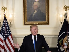 TOPSHOT - US President Donald Trump speaks about the Iran deal from the Diplomatic Reception room of the White House in Washington, DC, on October 13, 2017.
Trump announced he will not certify the Iran nuclear deal and warned that the US could leave the Iran deal 'at any time.' / AFP PHOTO / Brendan SMIALOWSKI