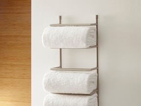 Crate & Barrel?s brushed steel wall-mounted towel rack ($69.95) creates a classy storage area.
