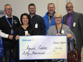 Walmart's Harmony Distribution Centre celebrated its grand opening in a big way on Thursday October 19, 2017 in Cornwall, Ont. The company donated $50,000 to the Agape Centre on behalf of its employees. Shown here are senior director of logistics Drew Robertson, Agape's executive director Dianne Plourde, Agape board member Gabriel Riviere-Reid, senior vice-president of logistics John Bayliss, Agape board members Johanne Couture and Marc Lecuyer.
Lois Ann Baker/Cornwall Standard-Freeholder/Postmedia Network
