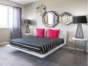 Contemporary: A seemingly floating bed is paired with a simple colour palette, a mixture of curves and straight lines, and plenty of mirrors to help light up a master bedroom. (Campanale Homes)