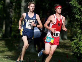 Andrew Davies, right, of Northern leads Cam Ross of Chatham-Kent during the senior boys' six-km race at the LKSSAA cross-country championship at Canatara Park in Sarnia, Ont., on Thursday, Oct. 19, 2017. Davies won in 20:38 and Ross placed second in 21:22. (Mark Malone/Postmedia Network)